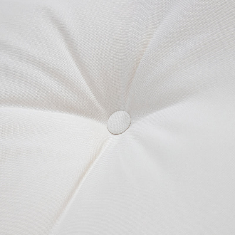 Close up of the tufted cushion of a four-piece transitional beige outdoor patio seating set with a table, two chairs, and a loveseat 