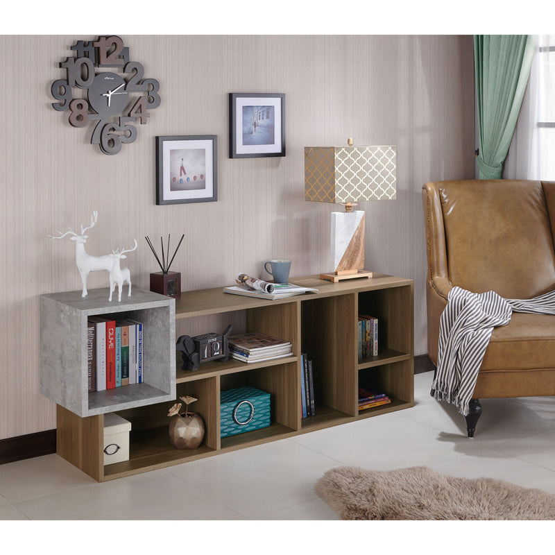 Right facing of a horizontal seven-shelf Industrial-style wood two-tone bookcase unit in a room with accessories