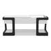 Front facing contemporary white and black storage coffee table with a half-width lift top on a white background