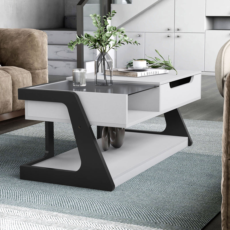 Right facing contemporary white and black storage coffee table with a half-width lift top in a room with accessories