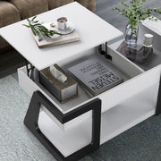 Right facing contemporary white and black storage coffee table with a half-width lift top in the raised position in a room with accessories
