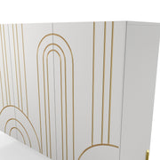 Left facing close up of the geometric design of a contemporary white three-door buffet with gold geometric accents on a white background