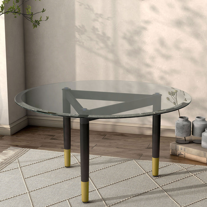 Right facing contemporary black three-legged triangle coffee table base (top not included) shown with a top on in a room with accessories