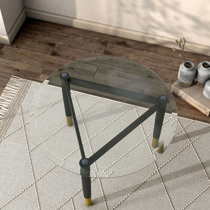 Right facing bird's eye view of a contemporary black three-legged triangle coffee table base (top not included) shown with a top on in a room with accessories