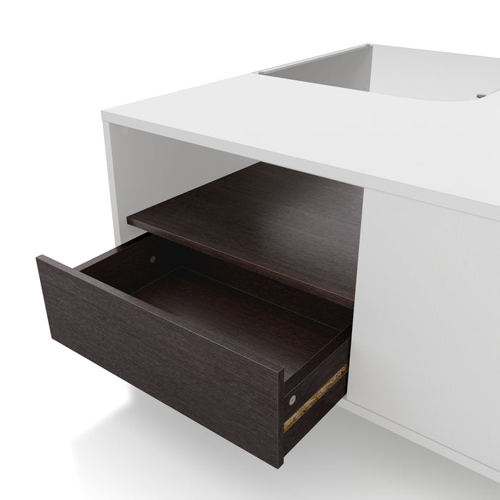Left facing close up of the open drawer of a contemporary white and brown storage coffee table with a glass inset and LED lighting on a white background