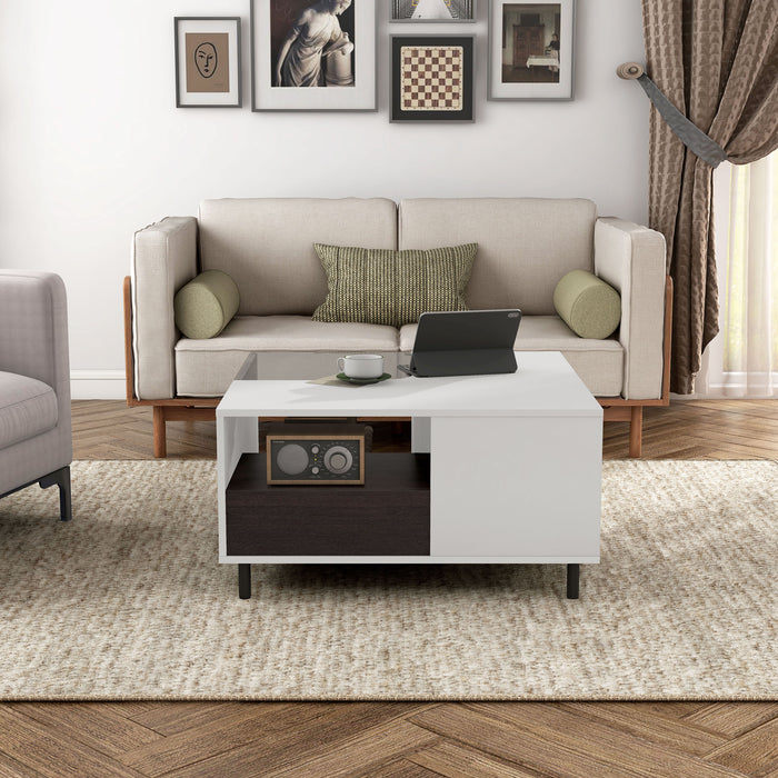 Front facing a contemporary white and brown storage coffee table with a glass inset and LED lighting in a room with accessories