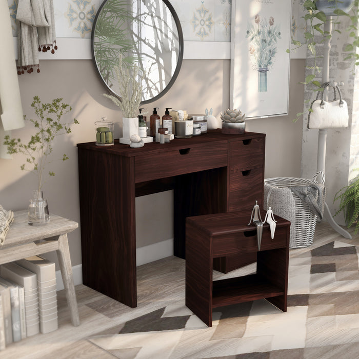 Right-angled walnut vanity table set with stool in a contemporary bedroom.  Two grooved handles on the table and one grooved handle on the stool indicate more storage space.