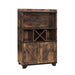 Right-angled distressed wood wine bar cabinet against a white background. Two hanging stemware racks, an X wine rack and barndoor cabinets create a rustic look.