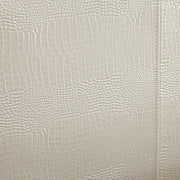 Detail shot of the pearl white faux crocodile leather upholstery.