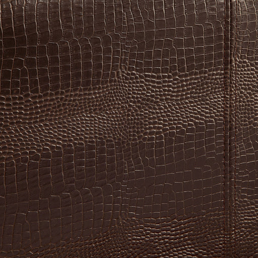 Detail shot of the brown faux crocodile leather upholstery.