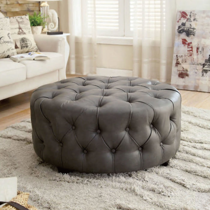 Latoya Button Tufted Bonded Leather Round Accent Ottoman