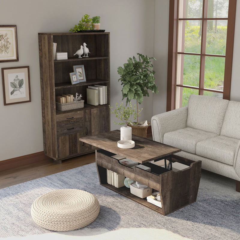 Top view of a reclaimed oak storage coffee table and bookcase set in a modern farmhouse style living room. The chest-like coffee table, in front of the beige loveseat, features a lift-top shelf with two storage compartments. The open shelf on the base frame also displays books and a basket. Three spacious shelves on the bookcase display more books and decor. An indoor tree cushions the corner between the bookcase and loveseat, while a round rattan floor ottoman sits in the foreground of the coffee table.