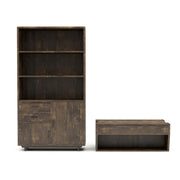Front-facing reclaimed oak storage coffee table and bookcase against a white background. The chest-like coffee table features an open shelf on the base frame. The matching bookcase offers 3 spacious shelves, 2 drawers, and 2 cabinets.