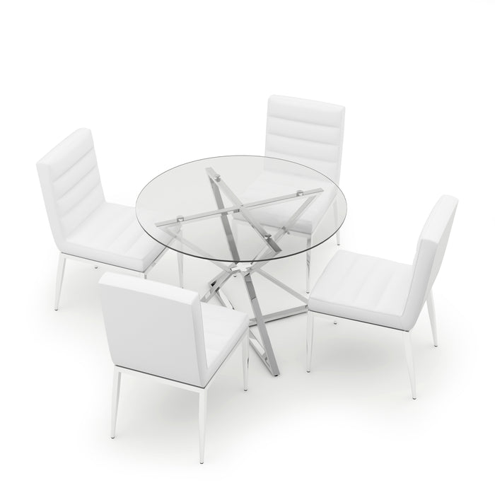 Top view of a round glass-top dining table on a chrome frame surrounded by four white leatherette upholstered chairs on chrome tapered legs. The frame of the dining table seen through the transparent glass-top creates a star-like hourglass shape, while the chair backrests and seats display deep horizontal tufts.