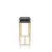 Side angle of faux black marble nesting tables with gold-tone frames on a white background.
