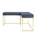 Blue and gold L-shaped office desk against a white background. Unexpected 3D facets add a retro vibe.