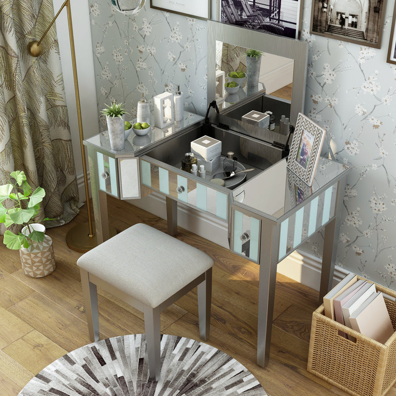 Top view of a silver vanity set in a bedroom.