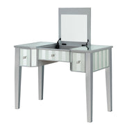 Left-angled silver vanity table against a white background. This vanity table features a lift-top with an underside mirror.