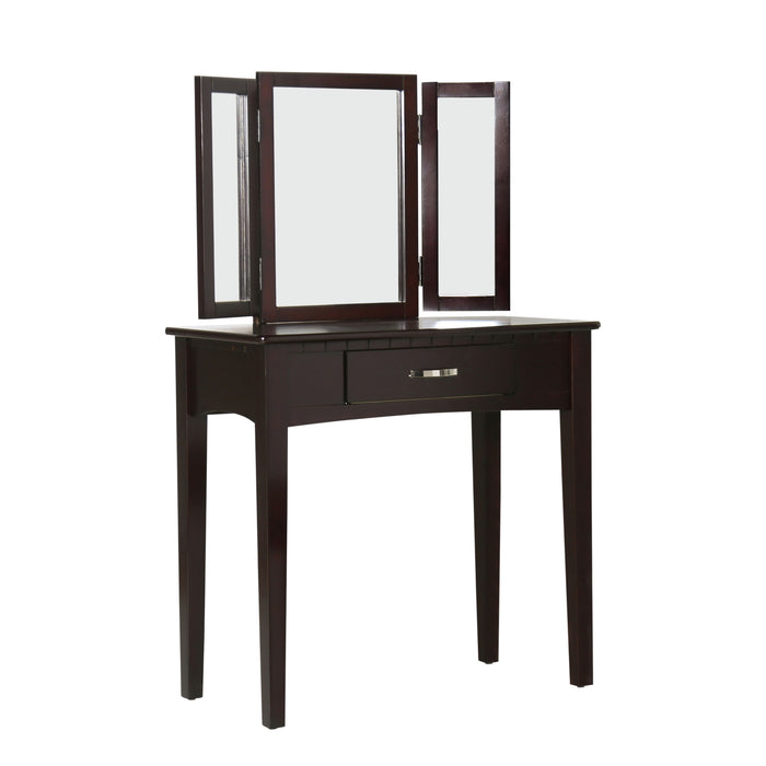 Right-angled espresso vanity table against a white background. A tri-fold mirror and drawer with silver bar pull sit on tapered legs.