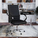 Right-angled black swivel chair in a chic home office. The high square back has channel tufting.