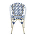 Backside of a navy and white octofoil pattern bistro chair back.