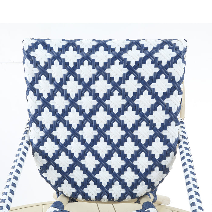 Detail shot of a navy and white octofoil pattern bistro chair seat.