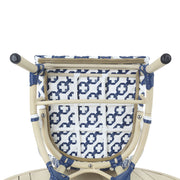 Bottom of a navy and white octofoil pattern bistro chair seat.