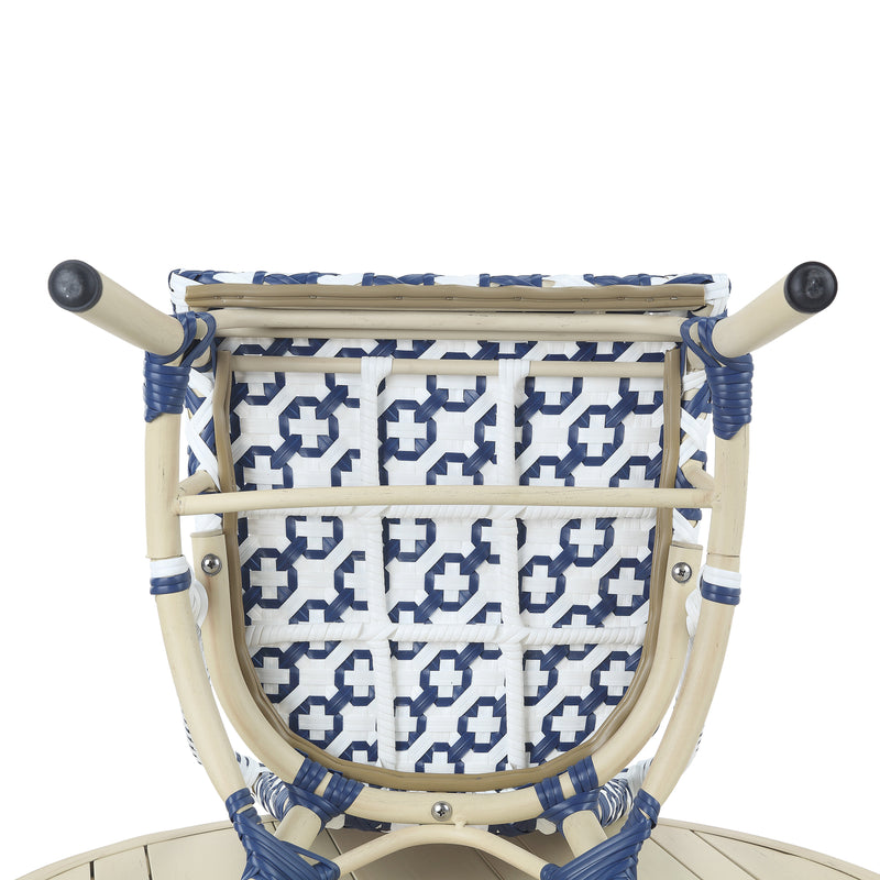 Bottom of a navy and white octofoil pattern bistro chair seat.