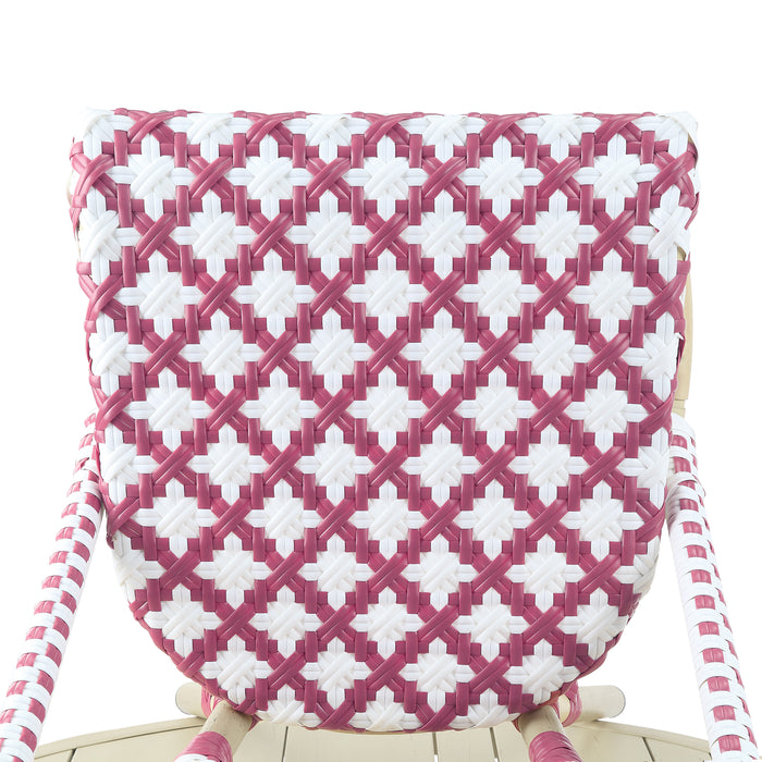 Detail shot of a pink patterned wicker bistro chair seat against a white background.