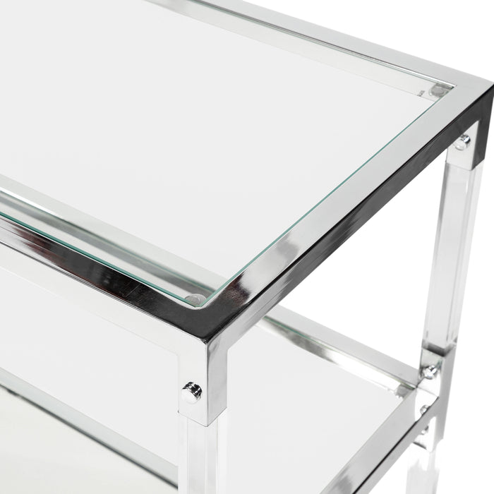 Top-down close-up view of glass shelves in acrylic and chrome steel frame on modern sofa table on a white background