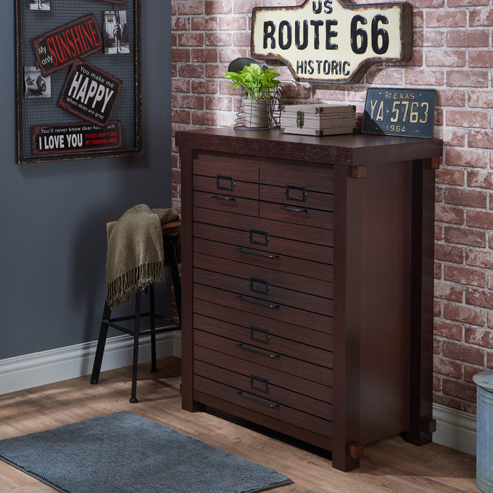 Left-angled six-drawer wood dresser on a brick wall with rustic accessories