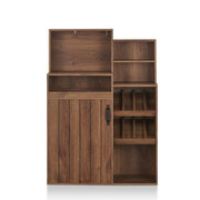 Front-facing distressed walnut wine bar cabinet against a white background. Above the countertop on the left is a metal hanging stemware rack. The tiered design features two shelves on the right, just above two display wine racks. Another large open shelf is on the bottom right. Above the slatted cabinet door is a pull-out tray.