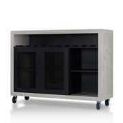 Left-angled cement and black wine bar cabinet against a white background. Ten (10) slots beneath the tabletop hold wine bottles, while the 3 stemware racks hang wine glasses. The right wire-mesh cabinet slides open to reveal 2 shelves. The entire buffet sits on wheels with parking brakes.