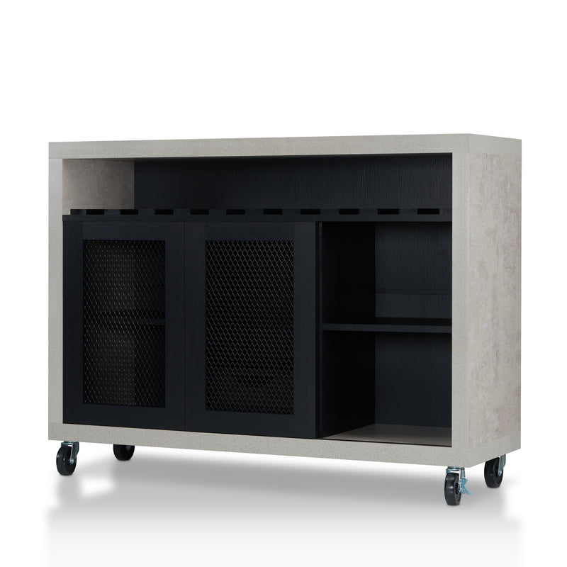 Left-angled cement and black wine bar cabinet against a white background. Ten (10) slots beneath the tabletop hold wine bottles, while the 3 stemware racks hang wine glasses. The right wire-mesh cabinet slides open to reveal 2 shelves. The entire buffet sits on wheels with parking brakes.