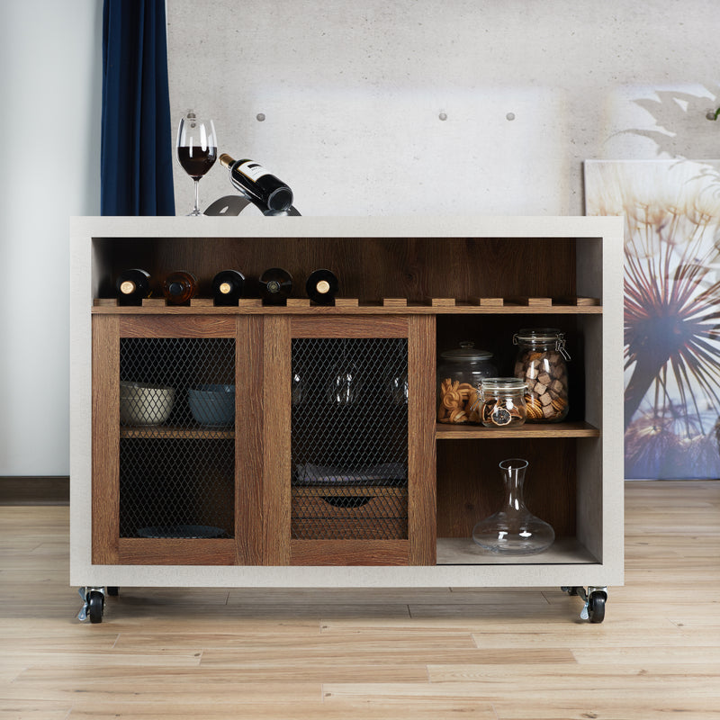 Straight-facing cement and distressed walnut wine bar cabinet against a white background. The 10 slots beneath the tabletop hold wine bottles, while the 3 stemware racks hang wine glasses. A plank-style drawer is flanked by wire-mesh cabinets. The entire buffet sits on wheels with parking brakes.