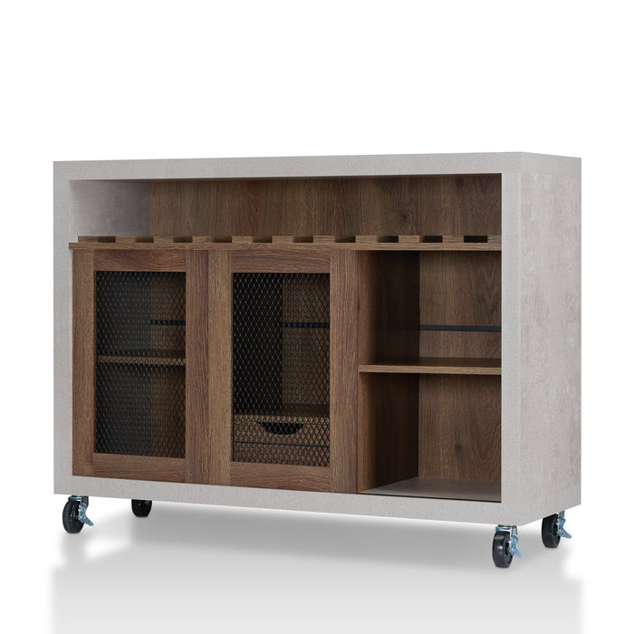 Left-angled cement and distressed walnut wine bar cabinet against a white background. Ten (10) slots beneath the tabletop hold wine bottles, while the 3 stemware racks hang wine glasses. The right wire-mesh cabinet slides open to reveal 2 shelves. The entire buffet sits on wheels with parking brakes.