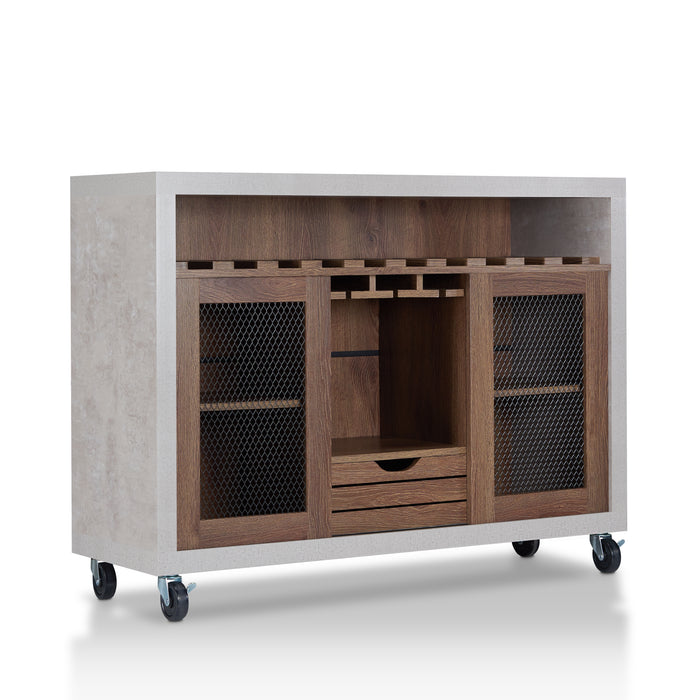 Right-angled cement and distressed walnut wine bar cabinet against a white background. The 10 slots beneath the tabletop hold wine bottles, while the 3 stemware racks hang wine glasses. A plank-style drawer is flanked by wire-mesh cabinets. The entire buffet sits on wheels with parking brakes.