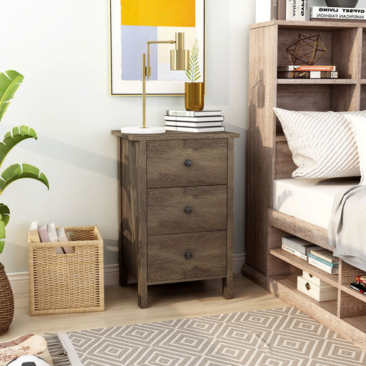 Right angled three-drawer nightstand in a distressed walnut finish in a bedroom with accessories