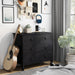 Right-angled transitional three-drawer dresser in black wood grain in a contemporary bedroom with accessories
