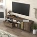 Left angled top view rustic three-shelf TV stand in reclaimed oak with drawer open in a living room with accessories