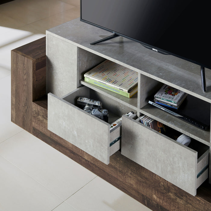 Left angled close up rustic faux concrete and reclaimed oak TV stand with drawers open in a living room with accessories