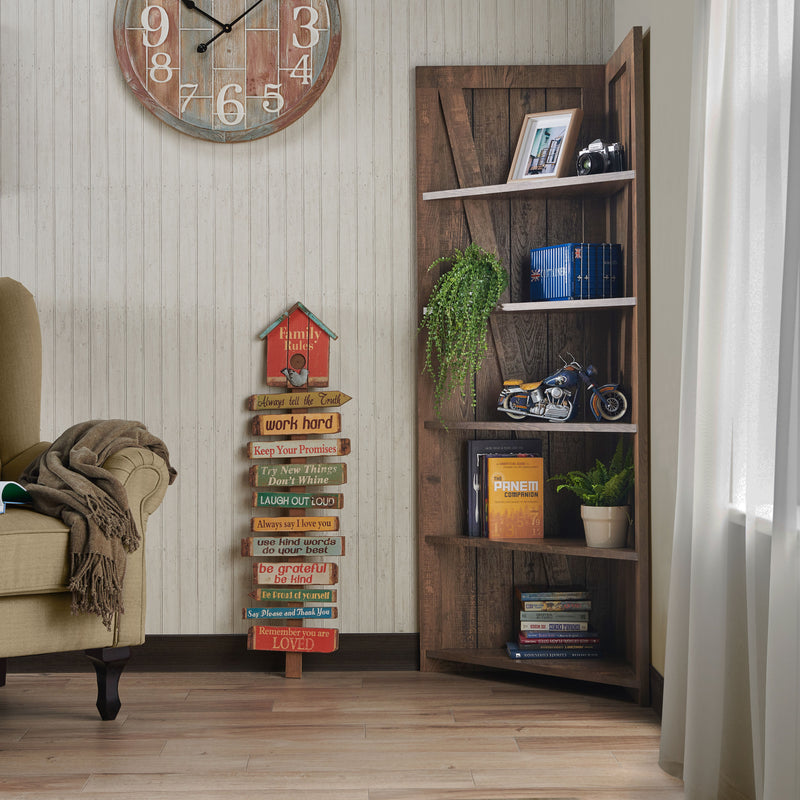 Left angled rustic reclaimed oak five-shelf corner bookcase in a sitting area with accessories