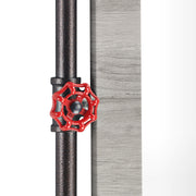 Detailed shot of a red water valve hook on an industrial mirror against a white background.