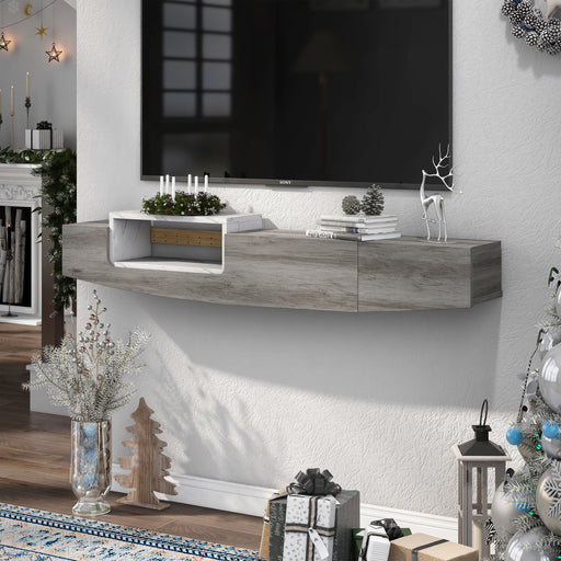 Grey and white faux marble TV console decorated with advent candles and surrounded by silver and blue Christmas decor.