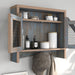 Right angled rustic distressed blue wall cabinet with metal mesh doors open in a living area with accessories