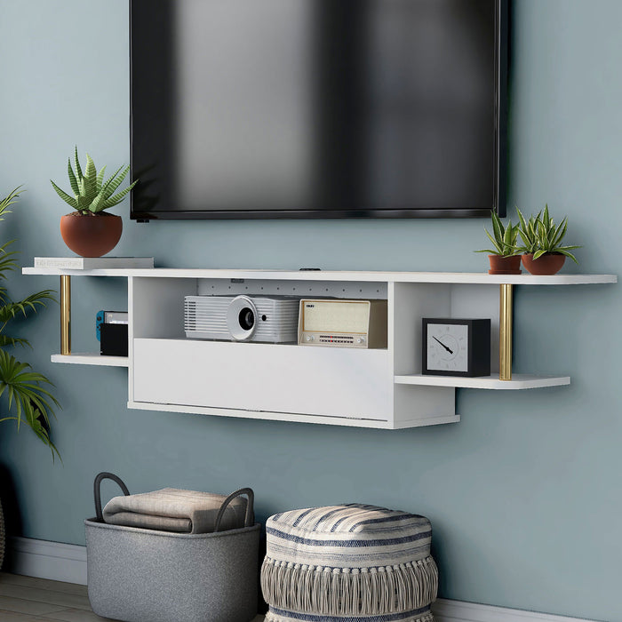 Left angled modern white floating TV console with three shelves installed on the wall of a living room with accessories