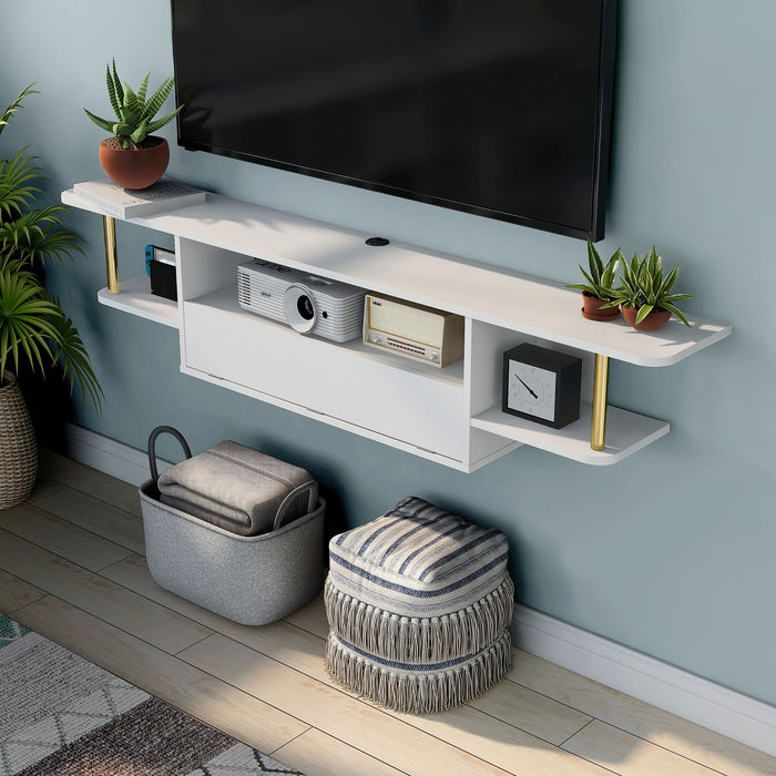 Left angled upper view of a modern white floating TV console with three shelves installed on the wall of a living room with accessories