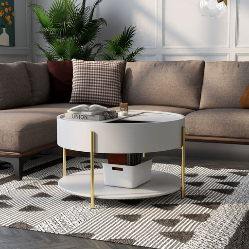 Left angled modern round white storage coffee table with a sliding top in a living area with accessories