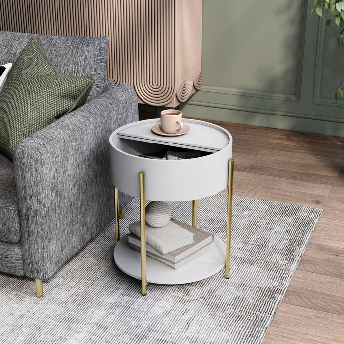 Left angled top view of a modern round white storage end table with its sliding top open in a living area with accessories