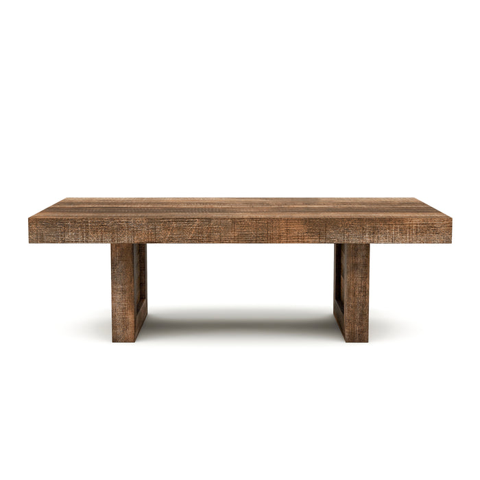 Front-facing, thick rectangular, coffee table against a white background. Unfinished solid mango wood craftsmanship is presented on sawblade-designed legs for a truly artisanal look.